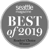 A round badge that reads "Seattle Magazine Best of 2019 Readers’ Choice Winner" in white text on a gray background.